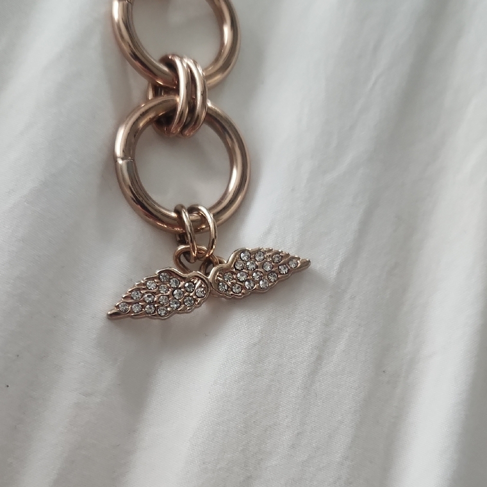 Victoria Secret Elegant Gold-Tone Toggle Bracelet with Crystal Wing Charm